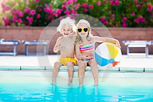 Kids playing at outdoor swimming pool