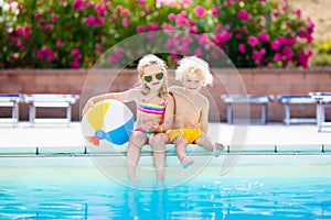 Kids playing at outdoor swimming pool