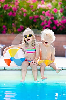 Kids playing at outdoor swimming pool