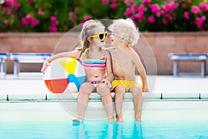 Kids playing at outdoor swimming pool