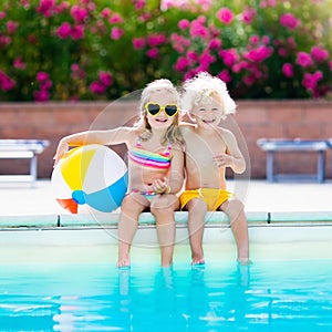 Kids playing at outdoor swimming pool