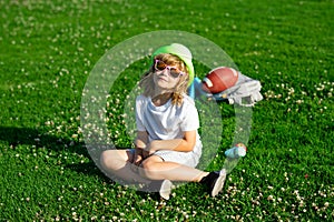 Kids playing outdoors in summer park. Freedom and carefree. Happy childhood. Relaxing kid in green field during summer