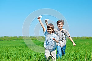 Kids playing with paper planes