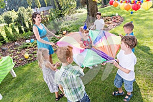 Kids playing parachute games