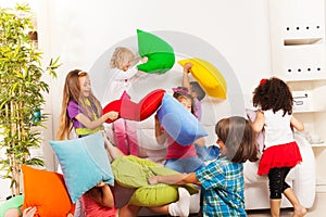 Kids playing pillow fight