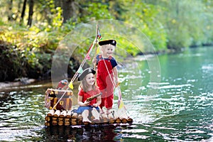 Kids playing pirate adventure on wooden raft