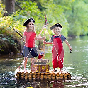 Kids playing pirate adventure on wooden raft