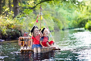 Kids playing pirate adventure on wooden raft