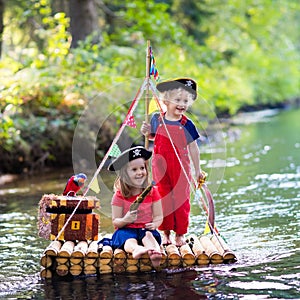 Kids playing pirate adventure on wooden raft