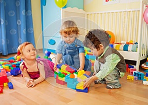 Kids playing with plastic blocks