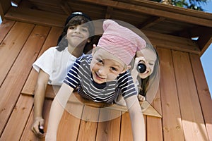 Kids Playing In Playhouse