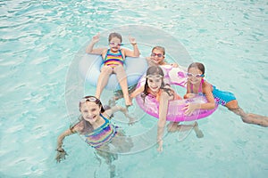 Kids playing in the pool on a summer day