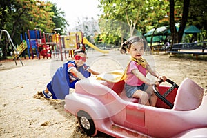 Kids Playing Riding Cart Outdoors Fun Nature Concept
