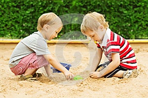 Kids Playing in Sand, Two Children Boys Outdoor Leisure in Sandbox