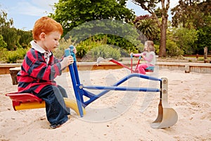 Kids playing in sandpit photo