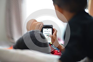 Kids playing smartphone