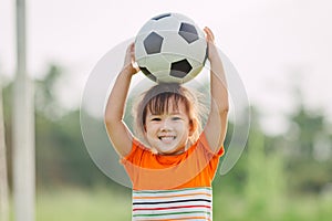 Kids playing soccer football.