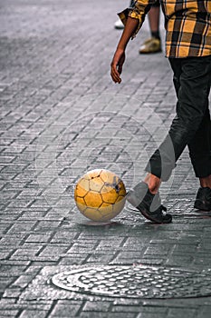 Kids playing soccer in the streets