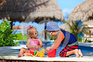 Kids playing in swimming pool at beach