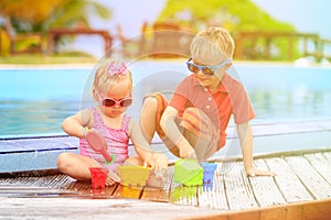 Kids playing in swimming pool at the beach