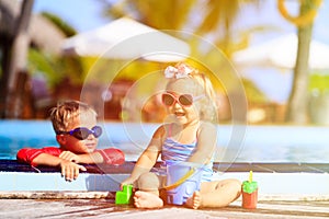 Kids playing in swimming pool at the beach