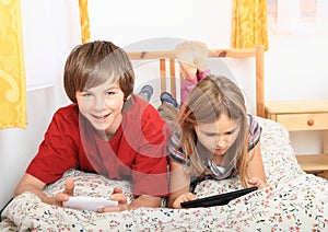 Kids playing with tablet and smartphone