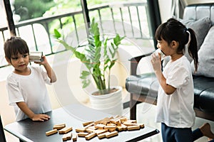 Kids playing with tin can and string phone as communication concept