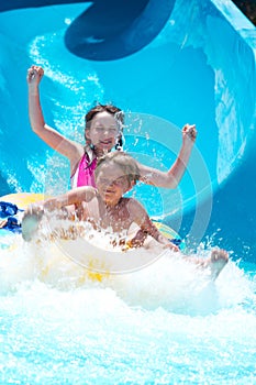 Kids playing on water slide