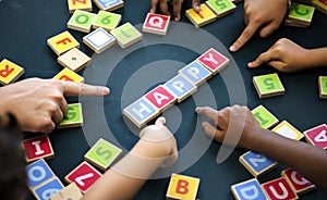 Kids playing wooden alphabets letters vocabulary ga