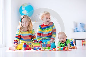 Kids playing with wooden toy train