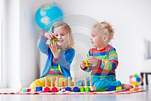 Kids playing with wooden toy train