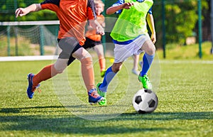 Kids playing youth football soccer match