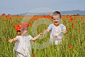 Kids on poppy field