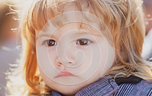 Kids portrait, close up head of serious baby child.