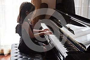 Kids practice play piano for up skill of music