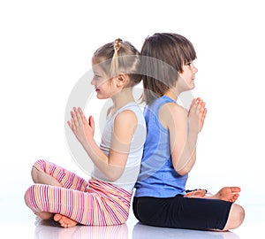 Kids practice yoga