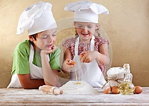 Kids preparing a cake photo