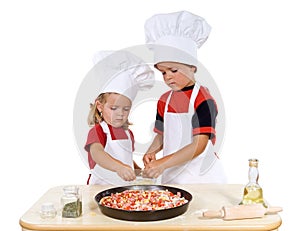 Kids preparing a pizza photo
