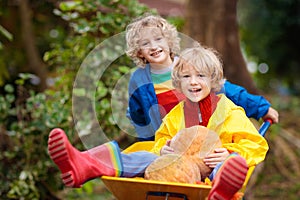 Kids on pumpkin patch. Child autumn outdoor fun