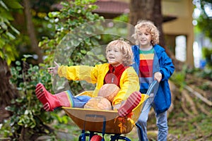 Kids on pumpkin patch. Child autumn outdoor fun