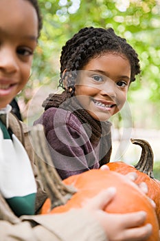 Kids with pumpkins photo