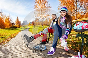 Kids putting on roller blades