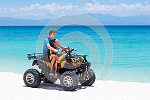 Kids on quad bike. Off road all terrain vehicle