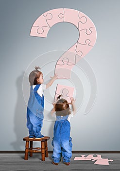 Kids question concept. Little childrens made question mark from