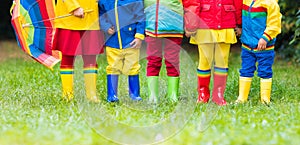 Kids in rain boots. Rubber boots for children.