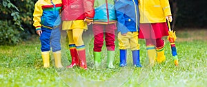 Kids in rain boots. Rubber boots for children.