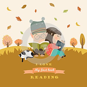 Kids reading book at autumn meadow