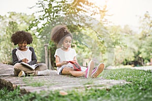 Kids reading with friend.