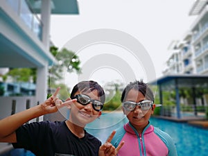 Kids ready for swimming at the swimming pool.