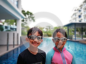 Kids ready for swimming at the swimming pool.